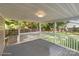 This back porch has a full roof with an open view of the backyard at 319 N Central Ave, Locust, NC 28097