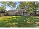 Nice fenced backyard featuring a covered porch and deck at 319 N Central Ave, Locust, NC 28097