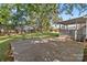 A large backyard featuring a covered patio, a fenced perimeter, and a concrete slab at 319 N Central Ave, Locust, NC 28097