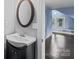 This bathroom features a vessel sink, a dark vanity, and a view of a spacious bedroom at 319 N Central Ave, Locust, NC 28097