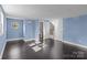 Bedroom with modern floors, multiple windows, and bright blue walls at 319 N Central Ave, Locust, NC 28097