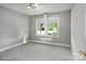 Bedroom with neutral carpet and a window providing natural light at 319 N Central Ave, Locust, NC 28097
