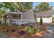 Beautiful home exterior featuring landscaping with a covered porch at 319 N Central Ave, Locust, NC 28097