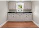 Classic kitchen featuring ample cabinet space and a window view at 319 N Central Ave, Locust, NC 28097