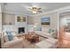 Staged living room showcasing a fireplace, hardwood floors, and neutral decor at 319 N Central Ave, Locust, NC 28097