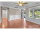 Spacious living room featuring a bay window, hardwood floors, and classic moldings at 319 N Central Ave, Locust, NC 28097