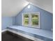 This dormer window seat is set in a cozy nook with natural light and views of the outdoors at 319 N Central Ave, Locust, NC 28097