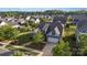 Aerial view of a single-Gathering home with a well-manicured lawn, mature trees, and an inviting curb appeal at 3267 Lock Erne Ave, Kannapolis, NC 28081
