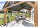 Inviting backyard patio with a gazebo, comfortable seating, and serene outdoor living space at 3267 Lock Erne Ave, Kannapolis, NC 28081