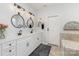 Bright bathroom with dual sinks, matte black fixtures and a framed door at 3267 Lock Erne Ave, Kannapolis, NC 28081