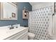 Stylish bathroom featuring a vanity with modern fixtures and a shower with a decorative curtain at 3267 Lock Erne Ave, Kannapolis, NC 28081