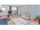 Cozy Bedroom featuring a crib, play area, and soft carpeting, perfect for a comfort at 3267 Lock Erne Ave, Kannapolis, NC 28081