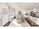 Well-lit dining area with hardwood floors, stylish light fixture, and access to the outdoor patio at 3267 Lock Erne Ave, Kannapolis, NC 28081