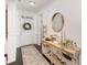Inviting foyer with hardwood floors, white wainscoting, decorative mirror, and stylish console table at 3267 Lock Erne Ave, Kannapolis, NC 28081