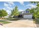 Charming gray home featuring a manicured lawn, mature landscaping and a two-car garage at 3267 Lock Erne Ave, Kannapolis, NC 28081