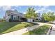 Charming gray home featuring a manicured lawn, mature landscaping and a two-car garage at 3267 Lock Erne Ave, Kannapolis, NC 28081