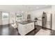 Well-lit kitchen featuring stainless steel appliances and a large island with granite countertops at 3267 Lock Erne Ave, Kannapolis, NC 28081