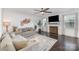 Cozy living room features a ceiling fan, hardwood floors, fire place and a neutral color palette at 3267 Lock Erne Ave, Kannapolis, NC 28081