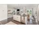 Open concept kitchen with a large island connected to a bright and spacious living area at 3267 Lock Erne Ave, Kannapolis, NC 28081