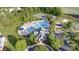 Aerial view of a community pool, playground, and tennis courts surrounded by green spaces at 3267 Lock Erne Ave, Kannapolis, NC 28081