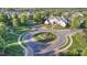 Overhead shot of a neighborhood roundabout featuring a large white mansion and manicured lawns at 3267 Lock Erne Ave, Kannapolis, NC 28081