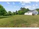 Expansive green backyard featuring a detached garage and plenty of open space at 34843 Ellis Spring Ct, Albemarle, NC 28001