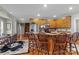 Charming kitchen features wood cabinets, a breakfast bar with stools, and hardwood floors at 34843 Ellis Spring Ct, Albemarle, NC 28001