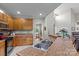 The kitchen features wooden cabinets, tile floors, stainless steel sinks, and a breakfast bar at 34843 Ellis Spring Ct, Albemarle, NC 28001