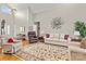 Bright living room with high ceilings, hardwood floors, and stylish furniture arrangements at 34843 Ellis Spring Ct, Albemarle, NC 28001
