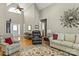 Spacious living room with vaulted ceilings, hardwood floors, and comfortable seating arrangements at 34843 Ellis Spring Ct, Albemarle, NC 28001