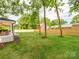Spacious backyard with new wooden privacy fence and view of neighboring homes at 3501 Providence Rd, Charlotte, NC 28211