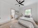 Bright bedroom featuring a ceiling fan and ensuite bathroom at 3501 Providence Rd, Charlotte, NC 28211