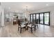 Dining area with modern decor open to kitchen and featuring sliding doors to a backyard patio at 3501 Providence Rd, Charlotte, NC 28211
