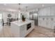 Stunning kitchen with stainless steel appliances, a large island, and seamless open flow to dining area at 3501 Providence Rd, Charlotte, NC 28211