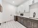 Well-equipped laundry room with ample counter space, modern cabinets, and a convenient sink at 3501 Providence Rd, Charlotte, NC 28211