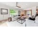 Open-concept living room with natural light, comfortable seating, and modern decor at 3501 Providence Rd, Charlotte, NC 28211