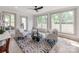 Bright living room with natural light from large windows, complemented by a modern ceiling fan at 3501 Providence Rd, Charlotte, NC 28211