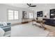 Inviting home office with hardwood floors, built-in shelving, and large windows at 3501 Providence Rd, Charlotte, NC 28211