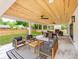 Covered outdoor patio with a dining area and lounge seating at 3501 Providence Rd, Charlotte, NC 28211