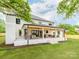 Wonderful covered brick patio with ample seating, perfect for outdoor relaxation and entertaining at 3501 Providence Rd, Charlotte, NC 28211