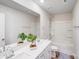 Well-lit bathroom featuring a double vanity, large mirror, and shower-tub combo for relaxation at 356 Runner Stone Ln, Fort Mill, SC 29715