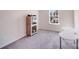 Cozy bedroom with carpet and natural light from the window, featuring an interesting display cabinet at 356 Runner Stone Ln, Fort Mill, SC 29715