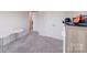 Spacious bedroom featuring plush carpet, double closets, and natural light from the hallway at 356 Runner Stone Ln, Fort Mill, SC 29715