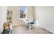 Bright bedroom features a workspace bathed in natural light, complemented by neutral tones and plush carpet at 356 Runner Stone Ln, Fort Mill, SC 29715