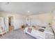 Spacious bedroom with carpet, with multiple entry doors and plenty of natural light at 356 Runner Stone Ln, Fort Mill, SC 29715