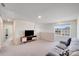 Comfortable bonus room with neutral tones, media center, and large window at 356 Runner Stone Ln, Fort Mill, SC 29715