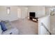 Spacious bonus room with plush carpeting, media console, and ample natural light at 356 Runner Stone Ln, Fort Mill, SC 29715