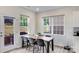 Cozy dining area with lots of light and a modern wood table at 356 Runner Stone Ln, Fort Mill, SC 29715