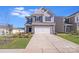 Charming two-story home with stone accents, well-maintained lawn, and a two-car garage at 356 Runner Stone Ln, Fort Mill, SC 29715