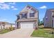 Charming two-story home with stone accents, well-maintained lawn, and a two-car garage at 356 Runner Stone Ln, Fort Mill, SC 29715